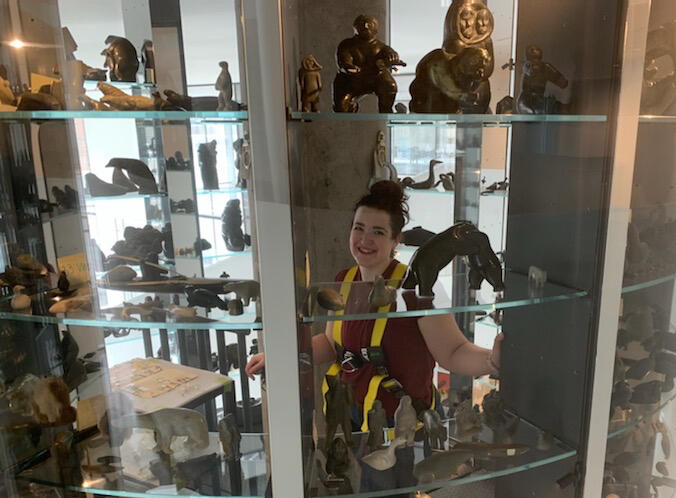 Nicole installing artworks in vault